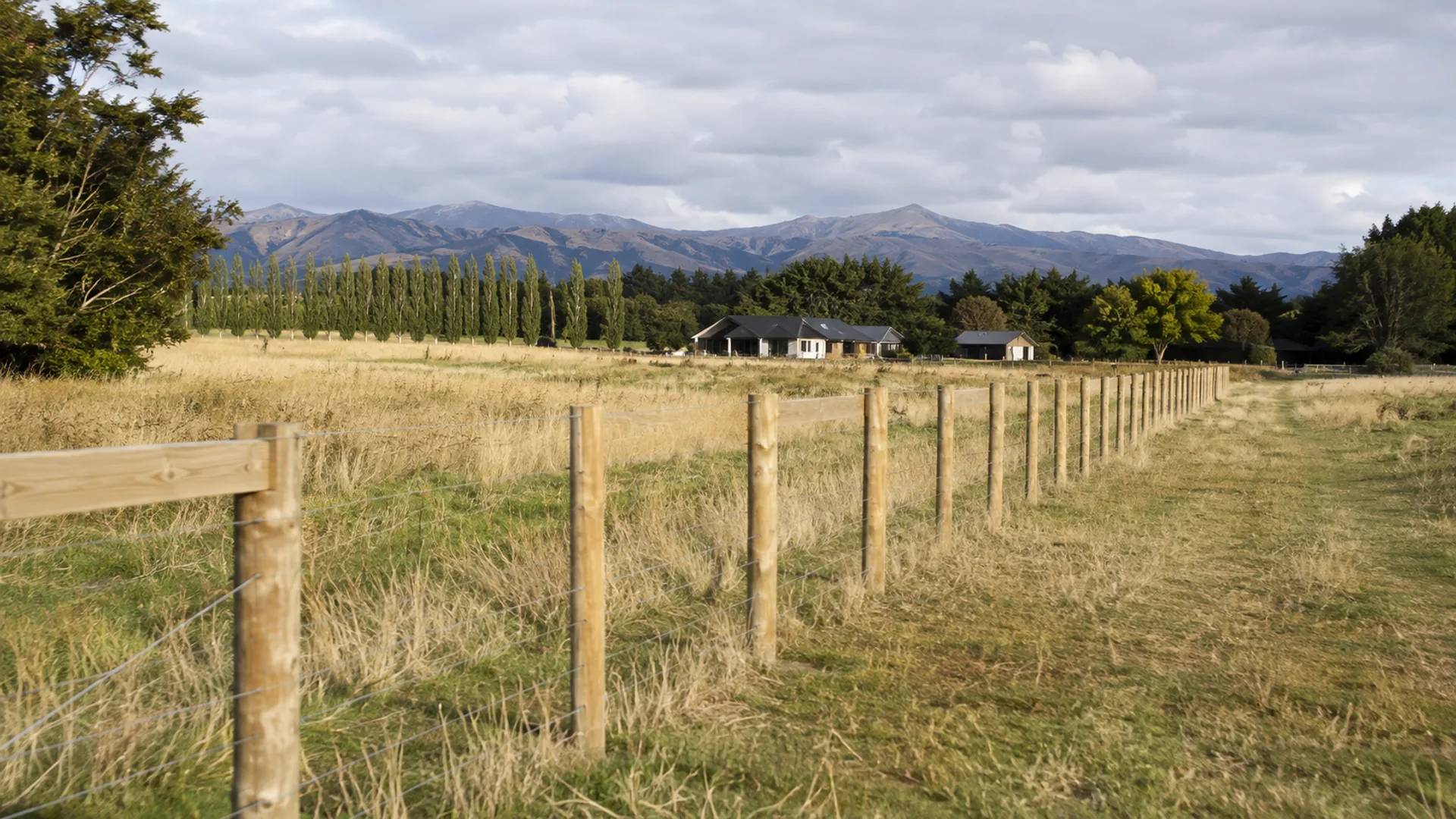 Post-and-rail fence across a Canterbury lifestyle block